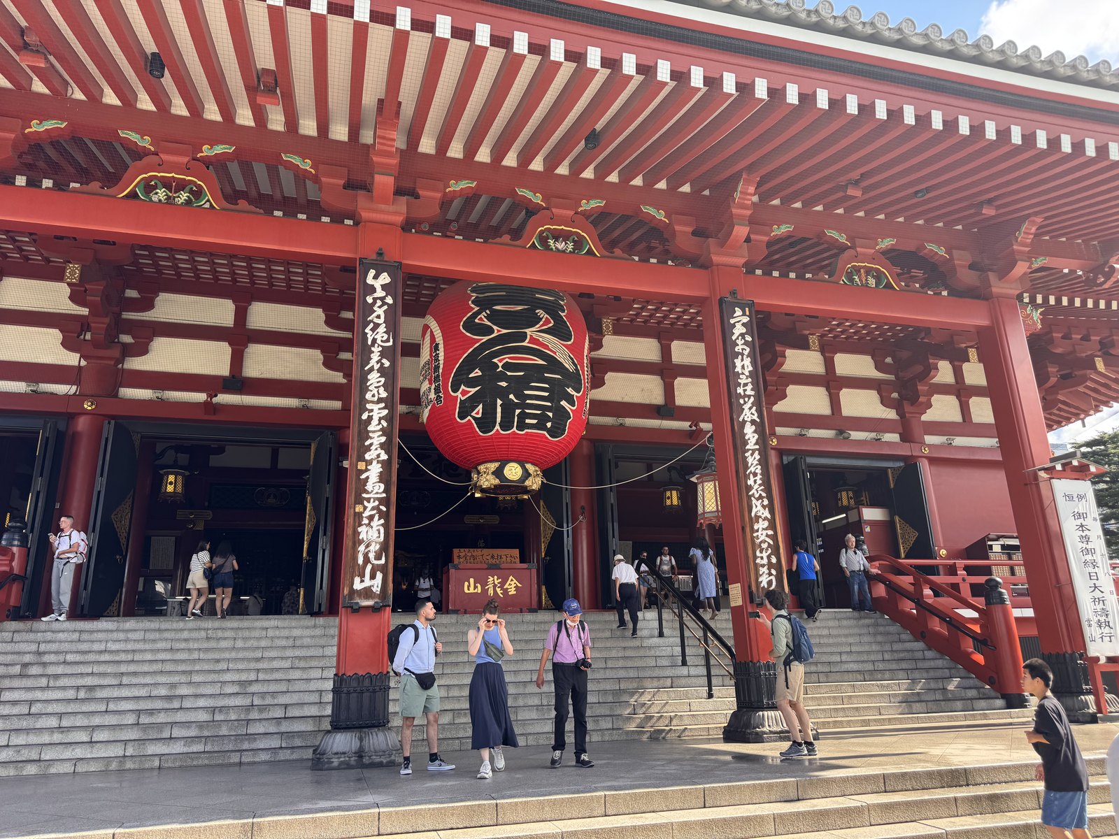 The Main Hall of Senso-ji open at 8:13 in the morning with visitors on the steps