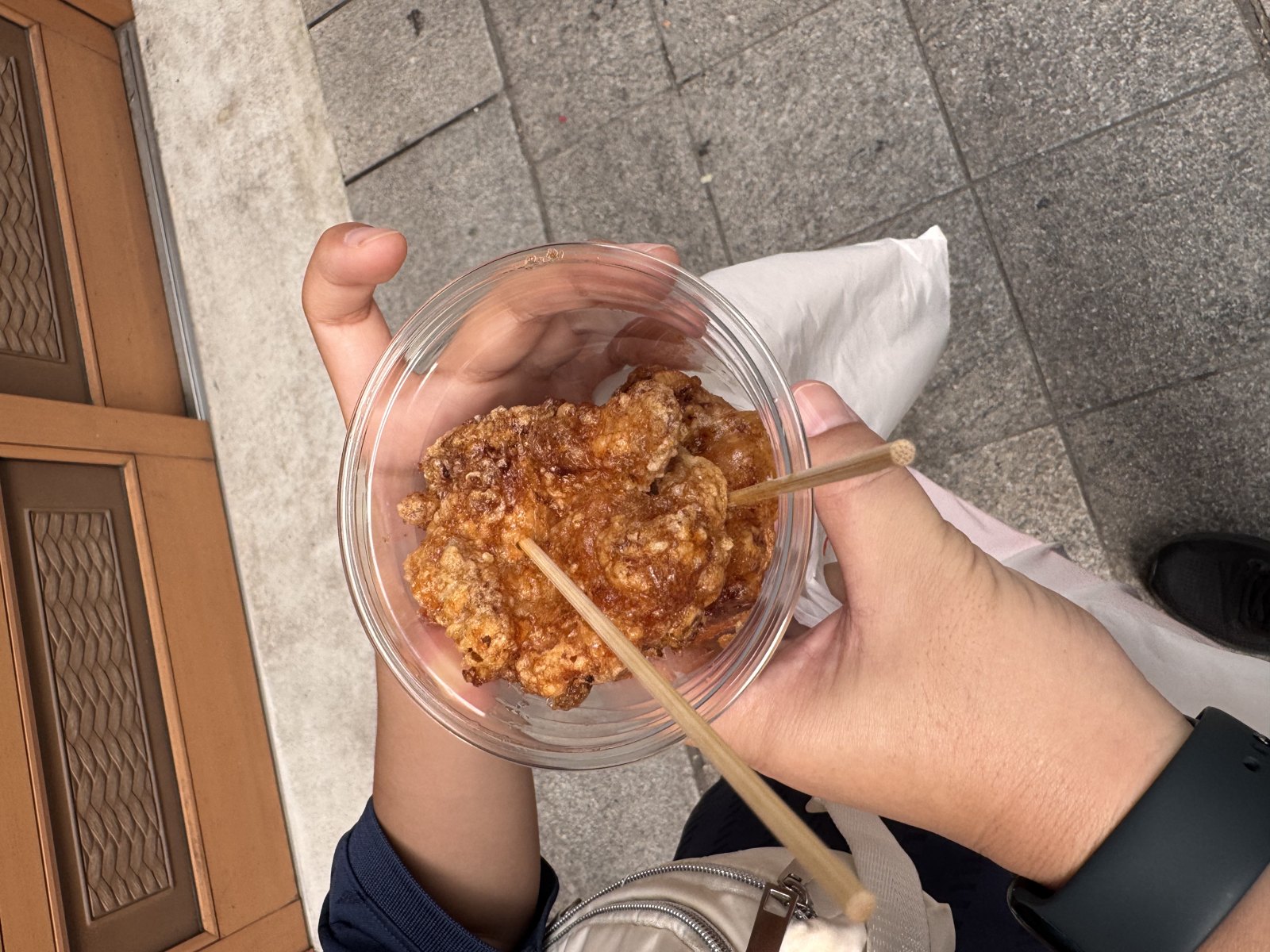 Takeaway karaage served in a clear cup with a wooden skewer at Osu, 12:45