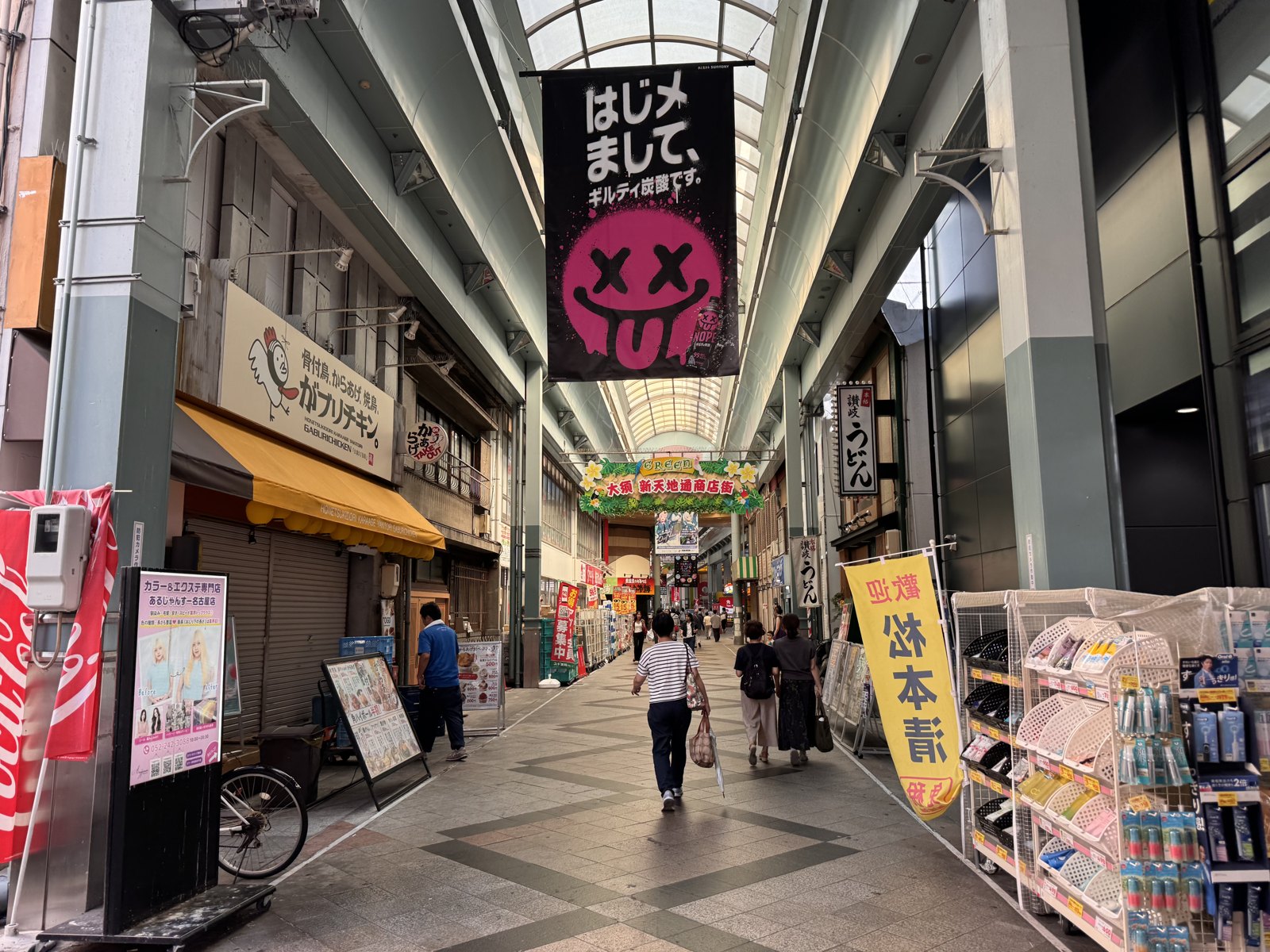 Shintenchi-dori arcade at 09:29 with most shops still shuttered