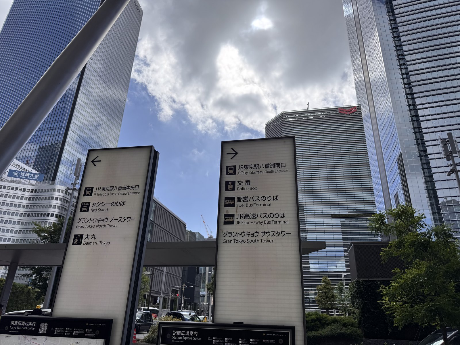 Signage and towers on the Yaesu side of Tokyo Station early on an August morning